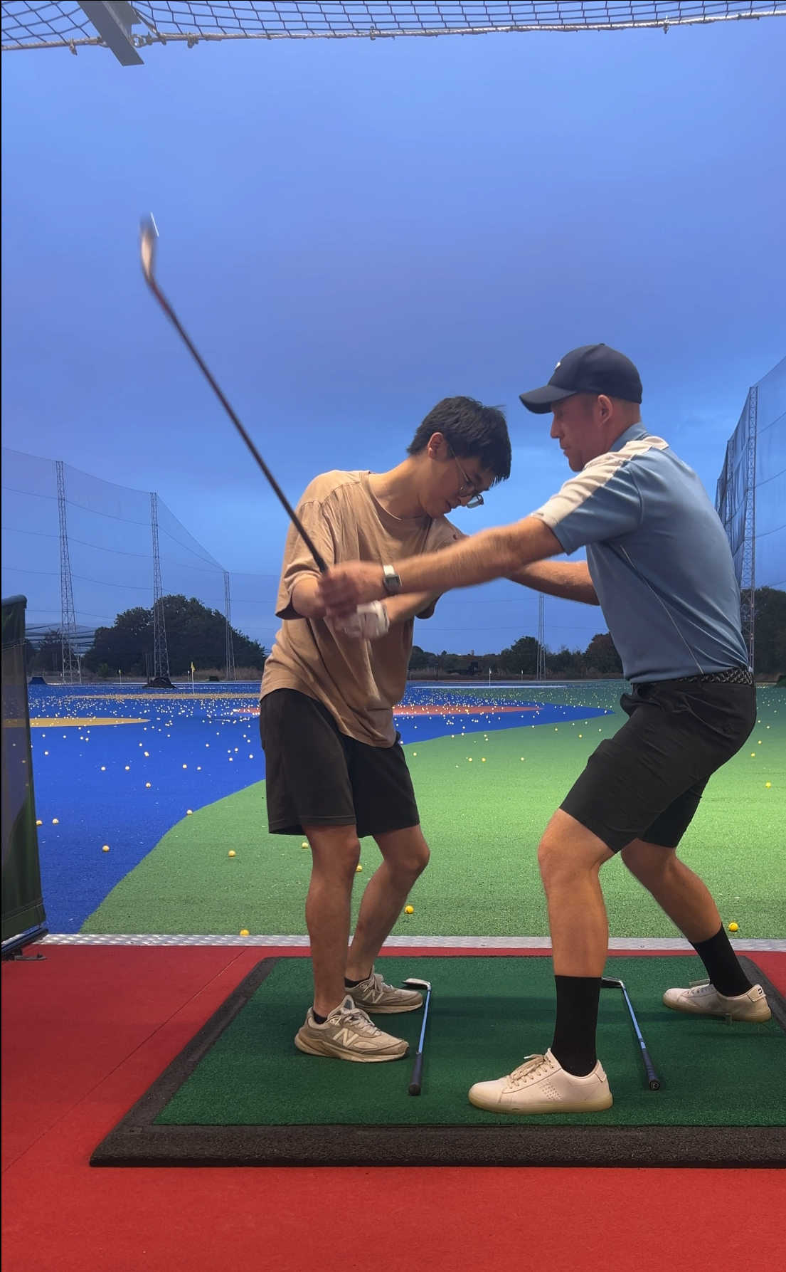 Mark Griffiths coaching a golfer at Good Time Golfin
